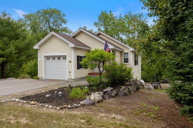 1313 Deer Run, Casco, ME 04015 - view of front of home featuring an attached garage and asphalt driveway