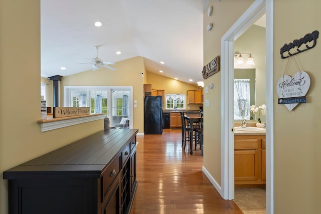 1313 Deer Run, Casco, ME 04015 - hallway featuring vaulted ceiling, wood finished floors, and recessed lighting