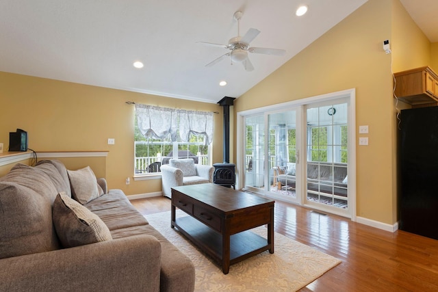 1313 Deer Run, Casco, ME 04015 - living area featuring a wood stove, light wood-style flooring, ceiling fan, recessed lighting, and high vaulted ceiling