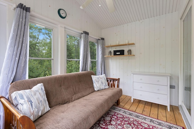 1313 Deer Run, Casco, ME 04015 - living room with hardwood / wood-style flooring, lofted ceiling, wooden walls, a ceiling fan, and wooden ceiling