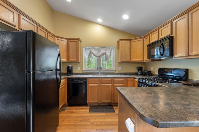 1313 Deer Run, Casco, ME 04015 - kitchen with black appliances, dark countertops, vaulted ceiling, light wood-style floors, and recessed lighting