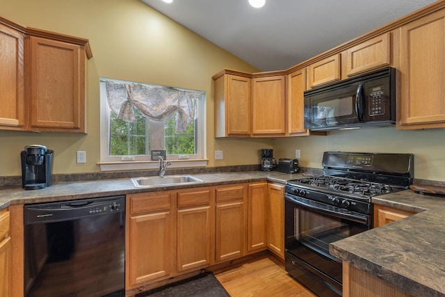 1313 Deer Run, Casco, ME 04015 - kitchen with black appliances, dark countertops, lofted ceiling, light wood finished floors, and recessed lighting