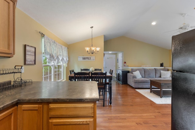 1313 Deer Run, Casco, ME 04015 - kitchen featuring freestanding refrigerator, vaulted ceiling, dark countertops, light wood-style flooring, and open floor plan