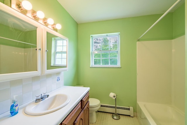 421 Cushing Rd, Cushing, ME 04563 - bathroom with baseboard heating, vanity, shower / washtub combination, backsplash, and tile patterned floors