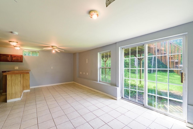 421 Cushing Rd, Cushing, ME 04563 - unfurnished living room featuring a ceiling fan and light tile patterned floors