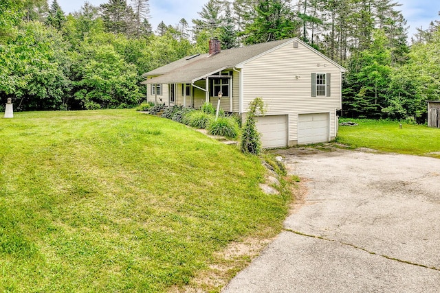 421 Cushing Rd, Cushing, ME 04563 - view of front of home with driveway, an attached garage, a front yard, a chimney, and view of scattered trees