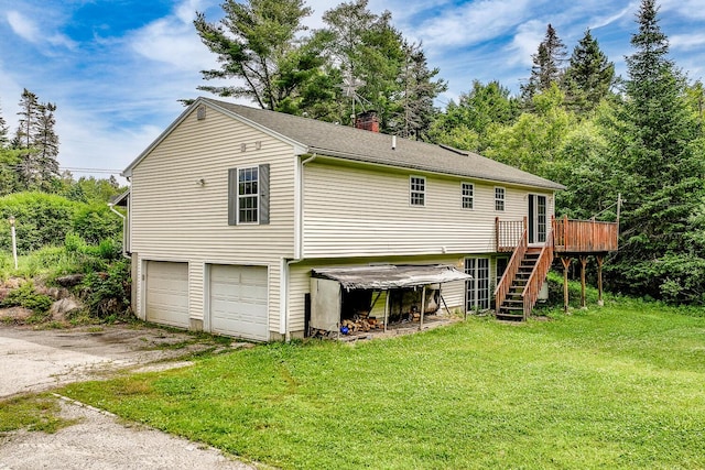 421 Cushing Rd, Cushing, ME 04563 - rear view of property with stairs, a wooden deck, a lawn, asphalt driveway, and a garage