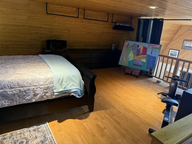 631 US Rt 1, Robbinston, ME 04671 - bedroom featuring wooden walls, wood finished floors, and wooden ceiling