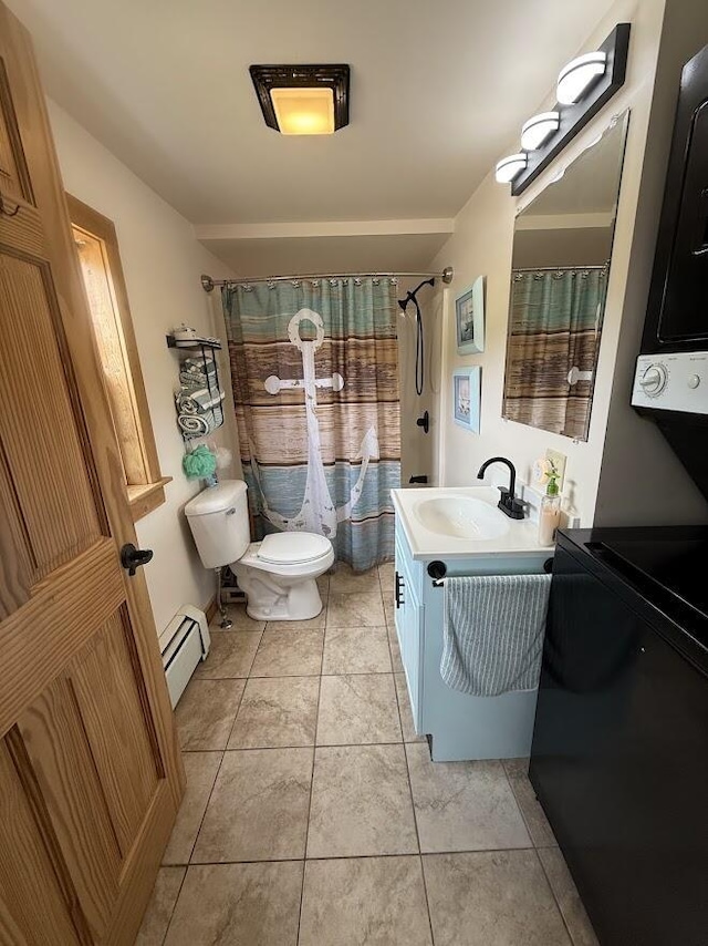 631 US Rt 1, Robbinston, ME 04671 - full bathroom featuring a baseboard heating unit, vanity, tile patterned floors, and a shower with curtain