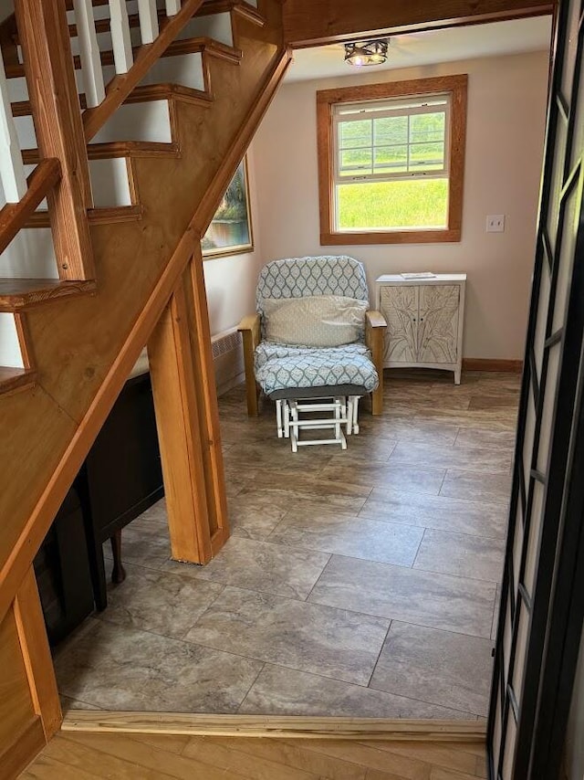 631 US Rt 1, Robbinston, ME 04671 - sitting room featuring stairs and stone finish floors