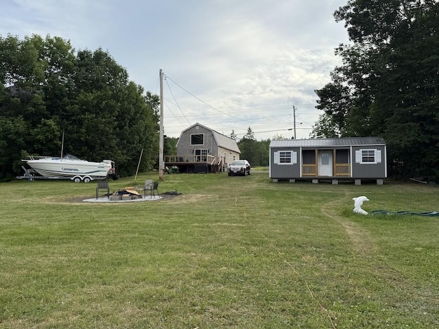 631 US Rt 1, Robbinston, ME 04671 - view of grassy yard featuring a fire pit