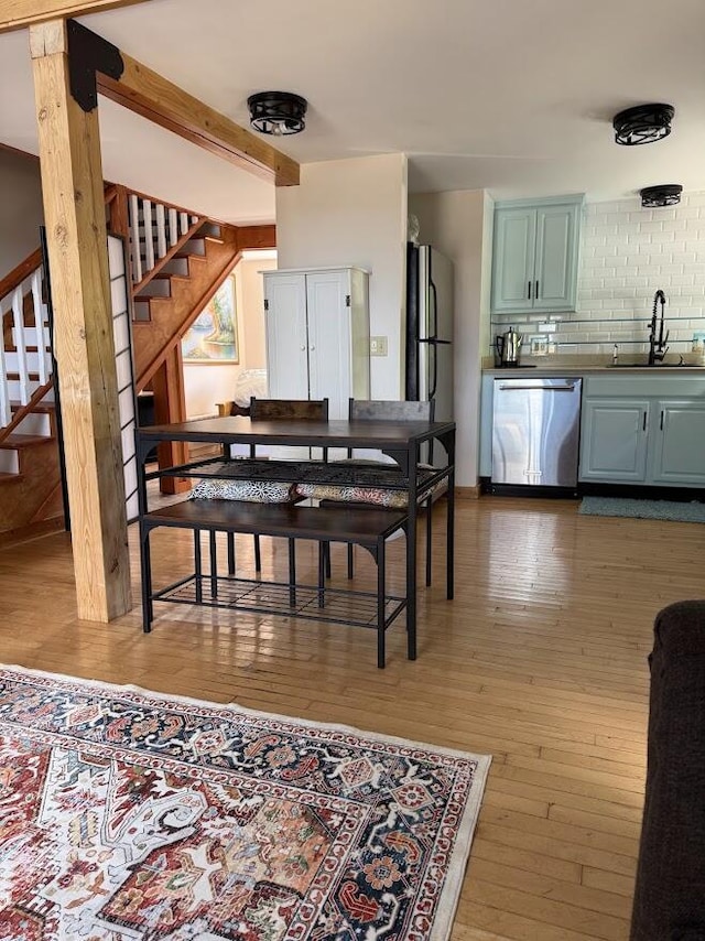 631 US Rt 1, Robbinston, ME 04671 - dining space featuring stairs and hardwood / wood-style flooring