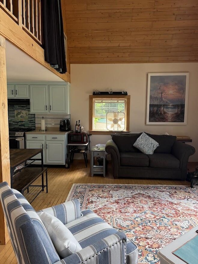 631 US Rt 1, Robbinston, ME 04671 - living area featuring light wood-type flooring and a high ceiling