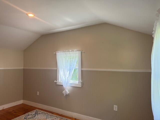 27 Dodge Rd, Edgecomb, ME 04556 - bonus room featuring vaulted ceiling, wood finished floors, and wainscoting