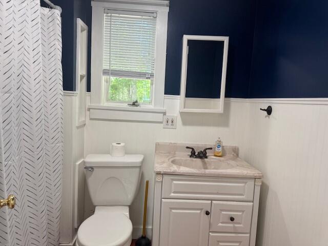 27 Dodge Rd, Edgecomb, ME 04556 - bathroom with vanity, wainscoting, and a shower with curtain
