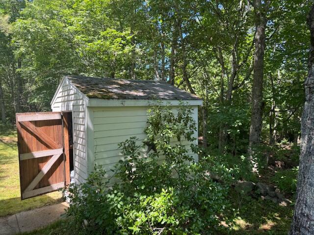 27 Dodge Rd, Edgecomb, ME 04556 - view of shed featuring a wooded view