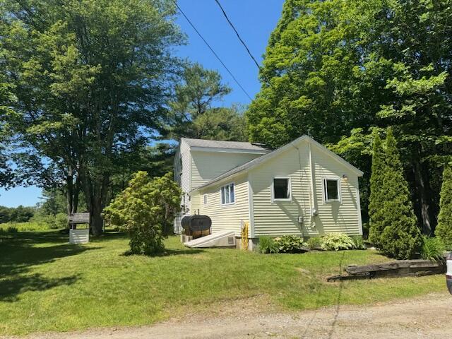 27 Dodge Rd, Edgecomb, ME 04556 - view of property exterior with a lawn and dirt driveway