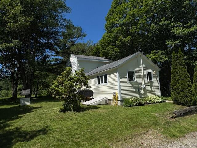 27 Dodge Rd, Edgecomb, ME 04556 - view of home's exterior featuring a lawn