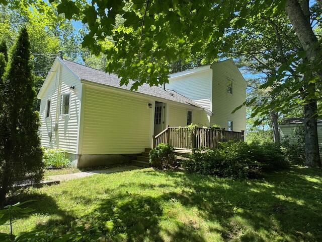 27 Dodge Rd, Edgecomb, ME 04556 - view of home's exterior featuring a deck and a yard