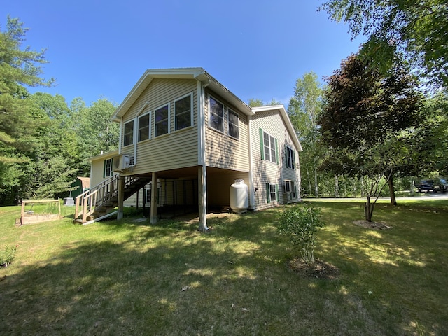 48 Stoney Ridge Rd, Eddington, ME 04428 - view of side of property with stairs and a lawn