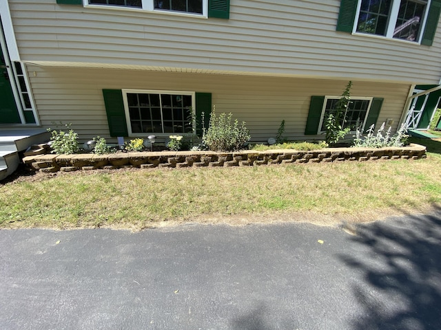 48 Stoney Ridge Rd, Eddington, ME 04428 - doorway to property featuring a lawn