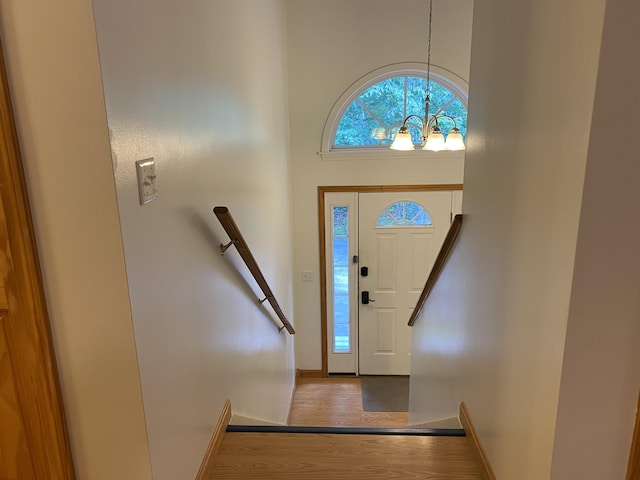 48 Stoney Ridge Rd, Eddington, ME 04428 - foyer featuring a chandelier, wood finished floors, and a high ceiling
