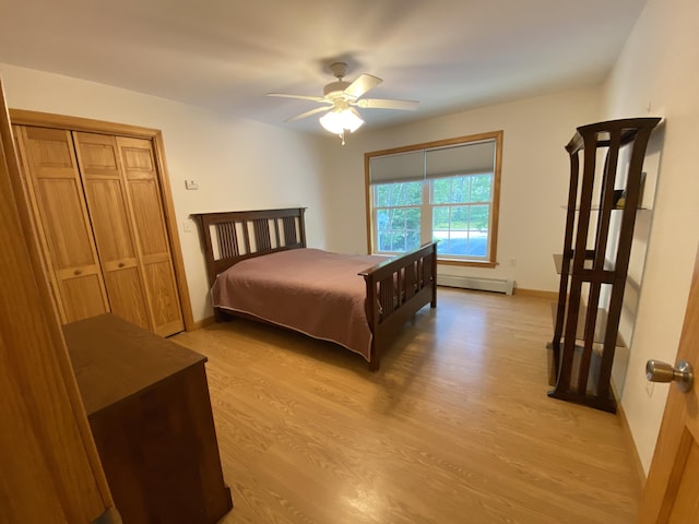 48 Stoney Ridge Rd, Eddington, ME 04428 - bedroom featuring light wood-style flooring, a baseboard heating unit, and ceiling fan