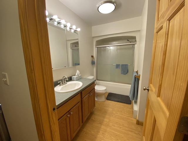 48 Stoney Ridge Rd, Eddington, ME 04428 - bathroom featuring vanity, wood finished floors, and enclosed tub / shower combo