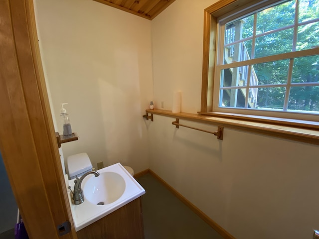 48 Stoney Ridge Rd, Eddington, ME 04428 - bathroom featuring baseboards and vanity