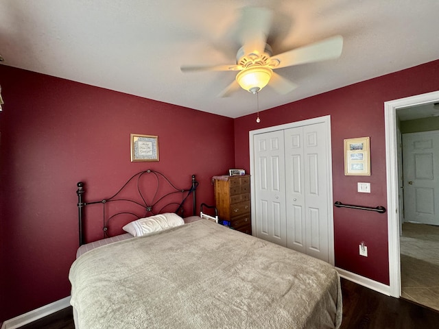 35A Birchbrook Ln Unit 35A, Levant, ME 04456 - bedroom with dark wood-style flooring, a closet, and a ceiling fan