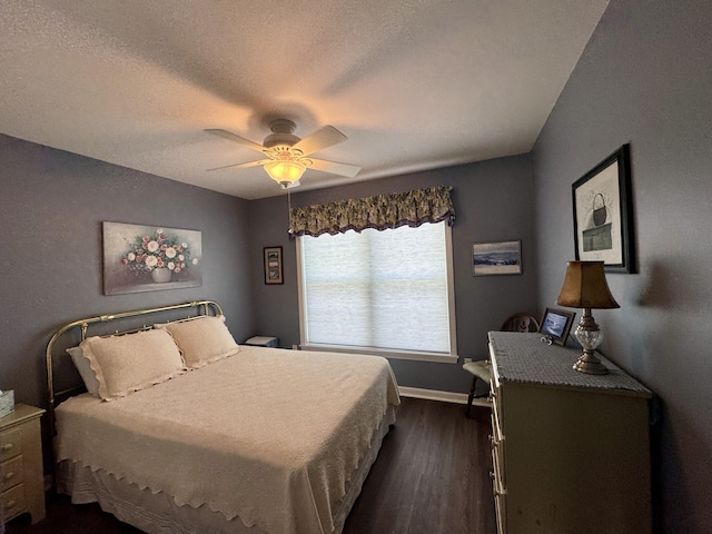 35A Birchbrook Ln Unit 35A, Levant, ME 04456 - bedroom with dark wood-style flooring, ceiling fan, and a textured ceiling