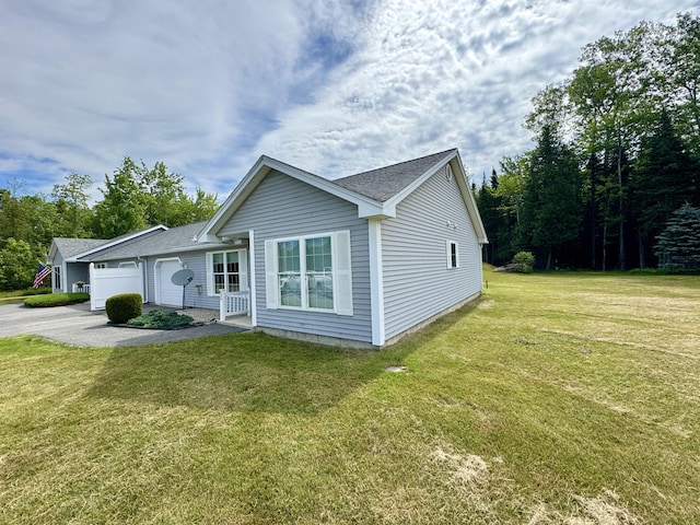 35A Birchbrook Ln Unit 35A, Levant, ME 04456 - ranch-style home with an attached garage, a front lawn, driveway, and a shingled roof