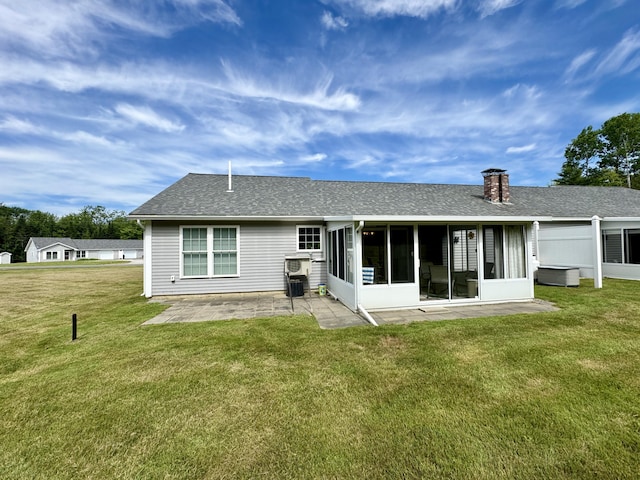 35A Birchbrook Ln Unit 35A, Levant, ME 04456 - back of house with a sunroom, a patio, a yard, and a shingled roof
