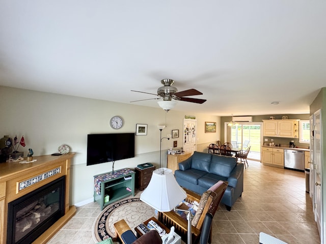 35A Birchbrook Ln Unit 35A, Levant, ME 04456 - living room featuring light tile patterned floors, a glass covered fireplace, and ceiling fan