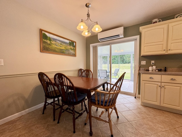 35A Birchbrook Ln Unit 35A, Levant, ME 04456 - dining space featuring a wall mounted air conditioner, light tile patterned floors, and a chandelier