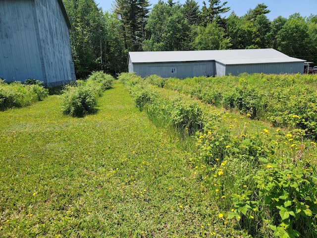 183 Folsom Pond Rd, Lincoln, ME 04457 - view of yard with a pole building and an outdoor structure