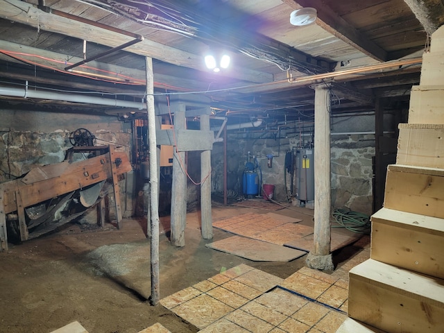 183 Folsom Pond Rd, Lincoln, ME 04457 - unfinished basement featuring a water pressure tank and water heater