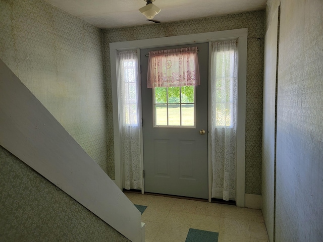 183 Folsom Pond Rd, Lincoln, ME 04457 - entryway with wallpapered walls and light flooring