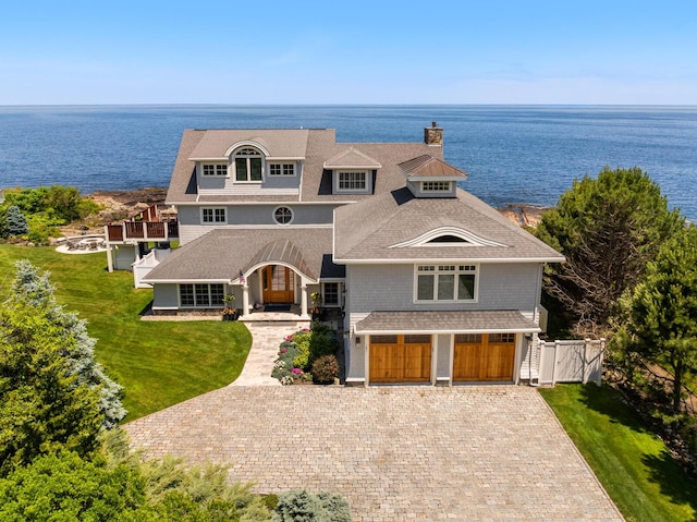 121 Bald Head Cliff Rd, York, ME 03902 - shingle-style home featuring a chimney, a garage, a water view, and decorative driveway