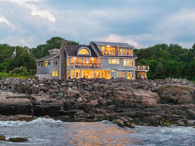121 Bald Head Cliff Rd, York, ME 03902 - back of house with a balcony, a chimney, and a metal roof