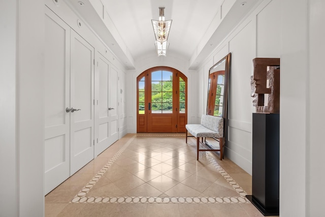121 Bald Head Cliff Rd, York, ME 03902 - foyer entrance with lofted ceiling, inlaid floor details, and light tile patterned floors