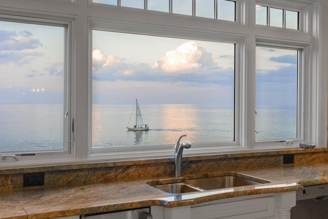 121 Bald Head Cliff Rd, York, ME 03902 - kitchen featuring white cabinets, dishwasher, and a water view