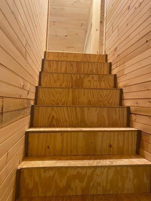 6 Chicken St, Starks, ME 04911 - stairs featuring wooden walls and a sauna / steam room
