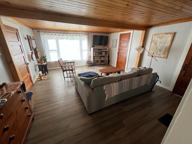 6 Chicken St, Starks, ME 04911 - living room with wood ceiling and dark wood-type flooring
