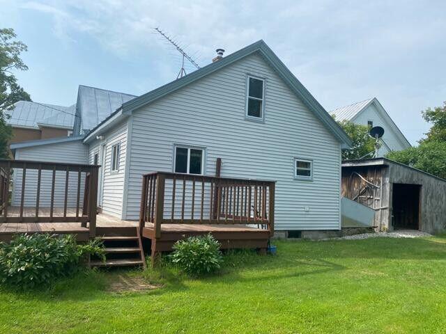 6 Chicken St, Starks, ME 04911 - back of property featuring a deck and a lawn