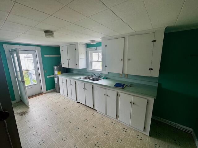 238 Shadagee Rd, Cornville, ME 04976 - kitchen with light countertops, white cabinets, plenty of natural light, and light flooring
