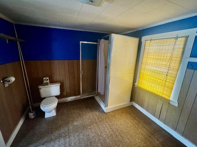 238 Shadagee Rd, Cornville, ME 04976 - full bath with wood walls, curtained shower, crown molding, and a wainscoted wall