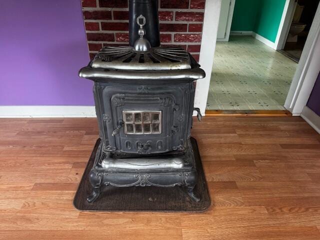 238 Shadagee Rd, Cornville, ME 04976 - detailed view of a wood stove and wood finished floors