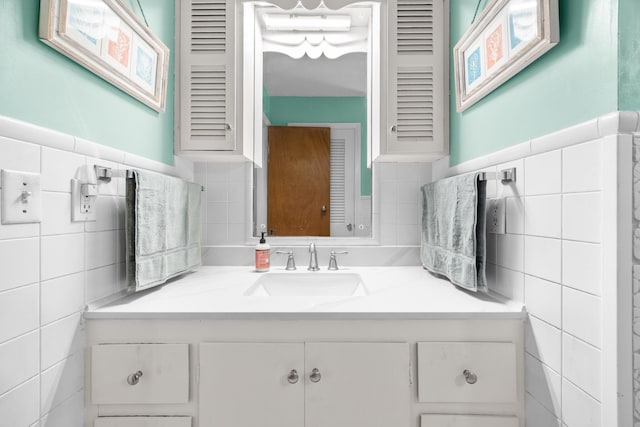 97 Forest Ave, Orono, ME 04473 - bathroom with tile walls, vanity, and a wainscoted wall