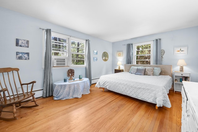 97 Forest Ave, Orono, ME 04473 - bedroom featuring light wood-style flooring and a baseboard heating unit